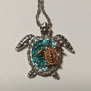 Sea turtle carrying baby necklace